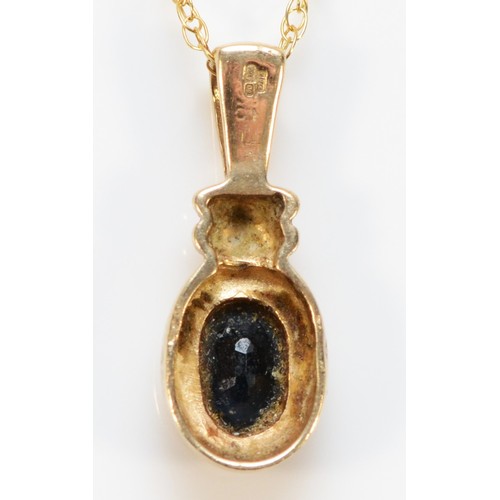 712 - A 9ct gold sapphire pendant with chain, 18mm total pendant length, 1.9g