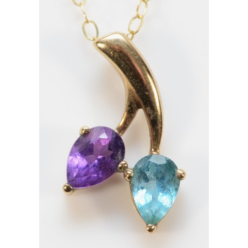 713 - A 9ct gold amethyst and blue topaz pendant with chain, 16mm pendant length, 1.3g