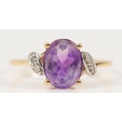 722 - A 9ct gold amethyst and white gemstone dress ring, 10mm x 7mm amethyst, S, 2.4g