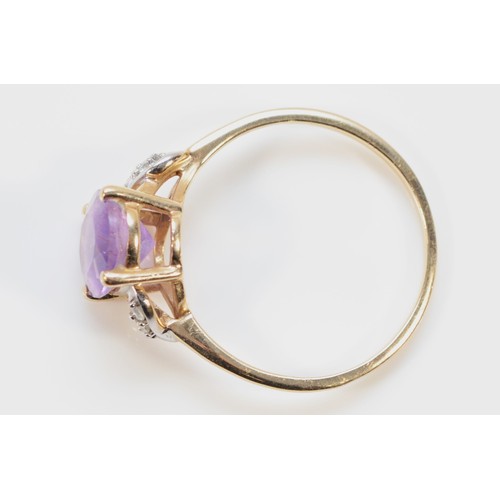 722 - A 9ct gold amethyst and white gemstone dress ring, 10mm x 7mm amethyst, S, 2.4g