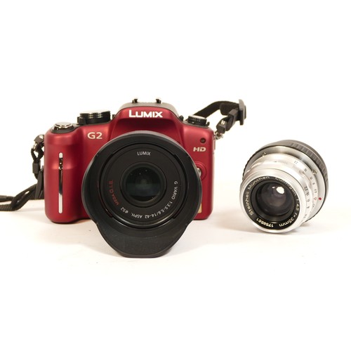 91 - A Panasonic Lumix G2 camera, with 14-42mm lens, along with various M4/3 adaptors including one with ... 