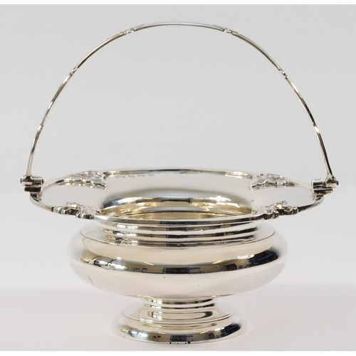 1 - An Edwardian silver swing handle basket, Birmingham 1907, raised on a pedestal foot, diameter 12.5cm... 