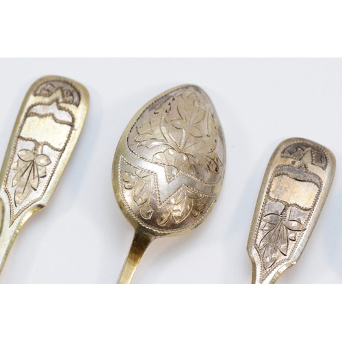 13 - A Russian silver gilt set of six coffee spoons, Moscow 1887, with engraved decoration, 56gm