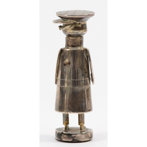 16 - An Edwardian silver 'Mr Popple' chauffeur pepper pot, by Saunders and Shepherd, Chester, 1907, detai... 