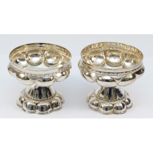 17 - A pair of Arts & Crafts silver chalices, by Nathan & Hayes, Chester 1910, in the form of Tudor cups,... 