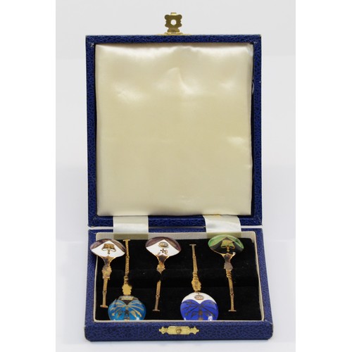 24 - A silver gilt and enamel set of five commemorative Coronation tea spoons, only two hallmarked, Birmi... 