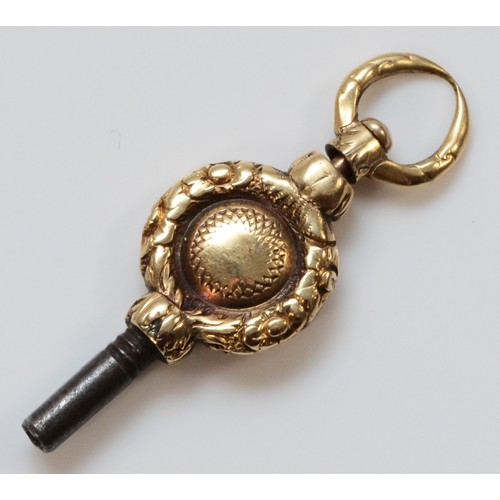 72 - A gold cased Georgian patterned watch key, 32mm total length, 2.8g