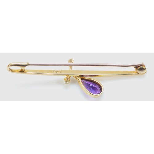 93 - A 15ct gold pear cut amethyst and seed pearl brooch with a 9ct gold pin, 45mm across, 2.2g