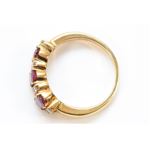 95 - A 14k gold diamond and enhanced ruby ring, three 6mm x 4mm oval enhanced rubys with eight brilliant ... 