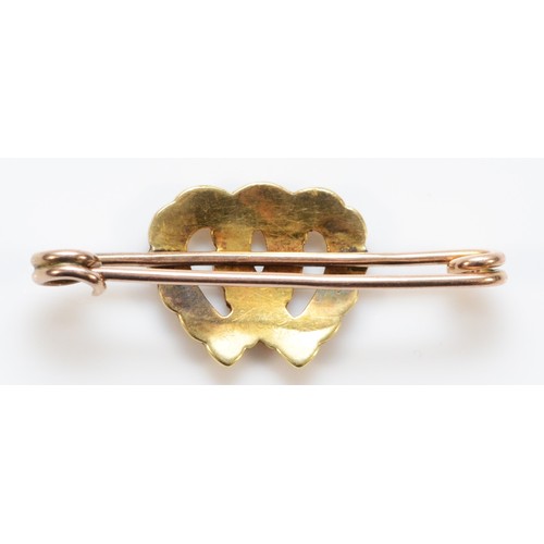 99 - An unmarked 15ct gold seed pearl brooch with a 9ct gold pin, seed pearls in the shape of interlockin... 