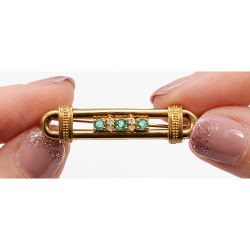 107 - A 9ct gold emerald and single cut diamond brooch, four diamonds between three 3mm emeralds, 35mm acr... 