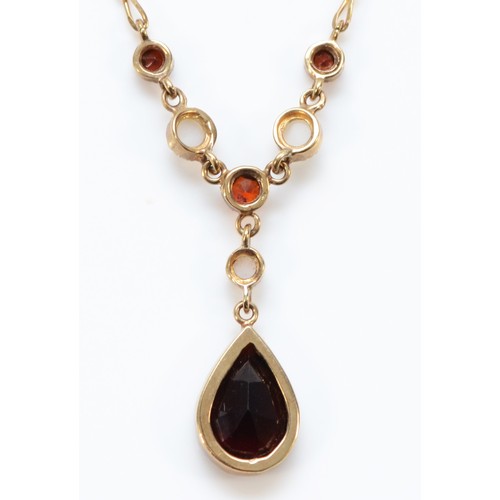 114 - A 9ct gold garnet and seed pearl drop necklace, main garnet measures 10mm x 7mm, 2.9g