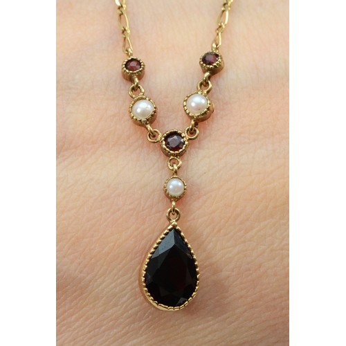 114 - A 9ct gold garnet and seed pearl drop necklace, main garnet measures 10mm x 7mm, 2.9g