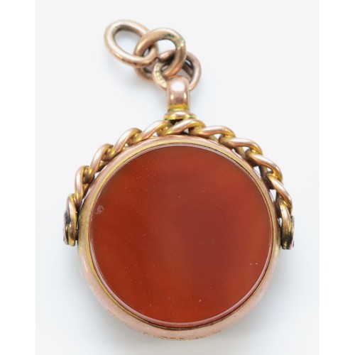 120 - A 9ct gold carnelian and agate spinner fob, Birmingham 1921, 15mm face diameter, 6.9g