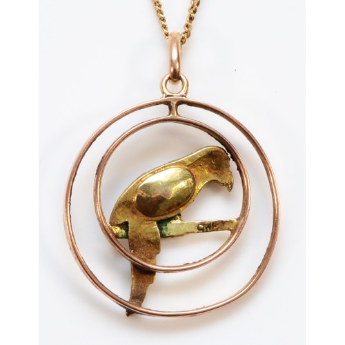 128 - An Edwardian 9ct rose gold, enamel and pearl parrot pendant, diameter 21mm, later chain, 4gm