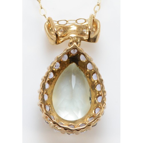 137 - A 9ct gold diamond, prasiolite and iolite pendant, with a chain, 20mm pendant length, 2.6g