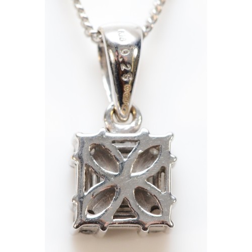 154 - A 9ct white gold vari cut diamond pendant, 6mm square, with a chain, 3.1g