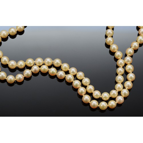 162 - A 9ct gold clasp cultured pearl necklace, floral clasp stamped with the maker JKa, double row of pea... 