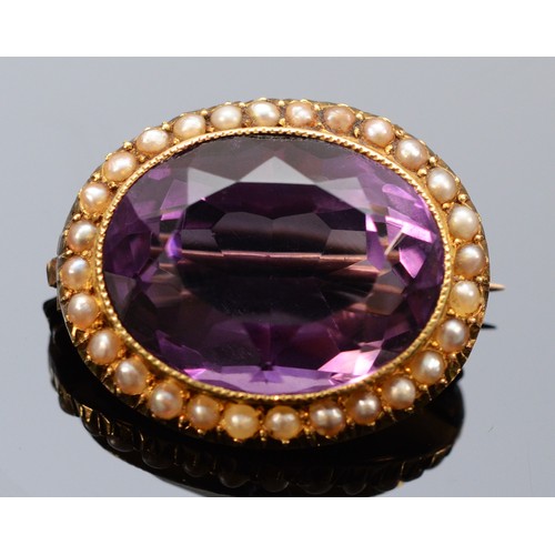 166 - A late Victorian amethyst and seed pearl brooch, 19mm x 15mm amethyst surrounded by a seed pearl bor... 