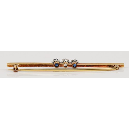 167 - An unmarked 15ct gold and platinum brilliant old cut diamond and sapphire three stone bar brooch, di... 