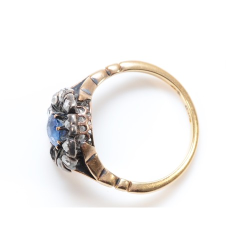 168 - An 18ct gold and silver old cut diamond and sapphire floral cluster ring, one diamond setting vacant... 