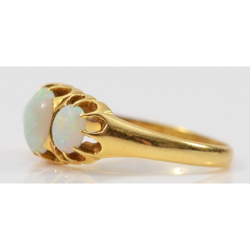 169 - An 18ct gold opal three stone ring, Birmingham 1910, central opal measures 7mm x 5mm, 3.2g