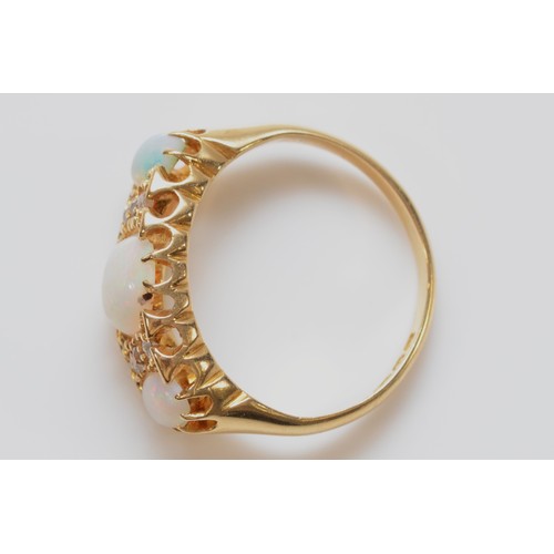 177 - A Victorian 18ct gold opal three stone ring, with rose cut diamonds between, M, 4.3gm