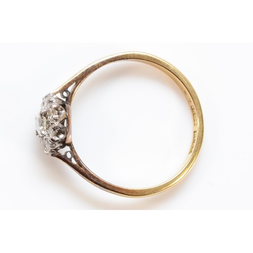 180 - An 18ct gold and platinum brilliant cut diamond floral cluster ring, approx 0.15ct central diamond s... 