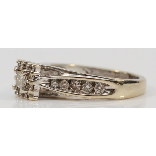 191 - Keepsake, a 14k white gold diamond dress ring, central Princess cut diamond surrounded by brilliant ... 