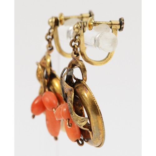 193 - A pair of Victorian unmarked 15ct gold antique patterned coral drop earrings with low carat screw ba... 