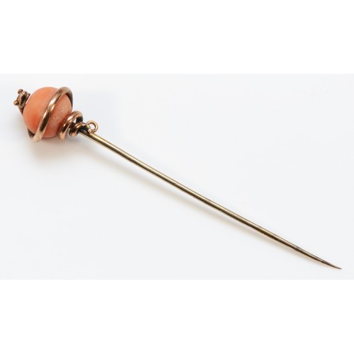 194 - A Victorian unmarked 15ct gold snake stick pin with a coral sphere, 70mm total length, 3.6g