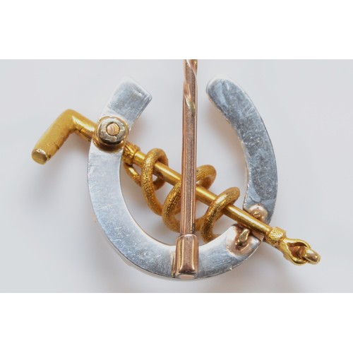 196 - An unmarked 15ct gold and platinum antique equestrian stick pin with a 9ct gold pin, platinum and go... 