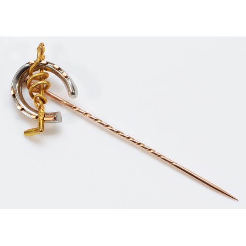 196 - An unmarked 15ct gold and platinum antique equestrian stick pin with a 9ct gold pin, platinum and go... 