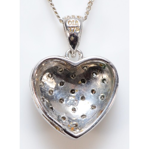 197 - A 9ct white gold pave set diamond heart shaped pendant with a chain, approx 0.10ct diamond weight, 1... 