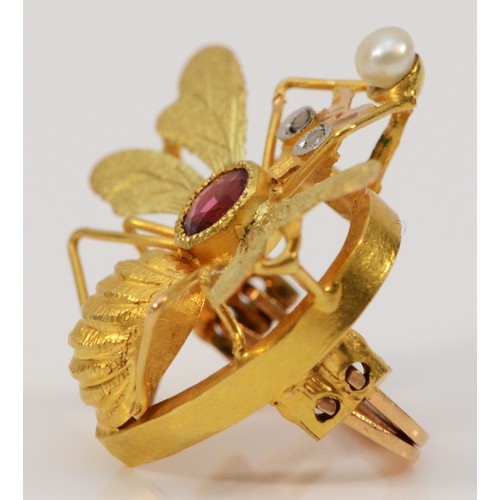 198 - An 18ct gold diamond, garnet topped doublet and seed pearl clip in the shape of a bee, French eagle ... 