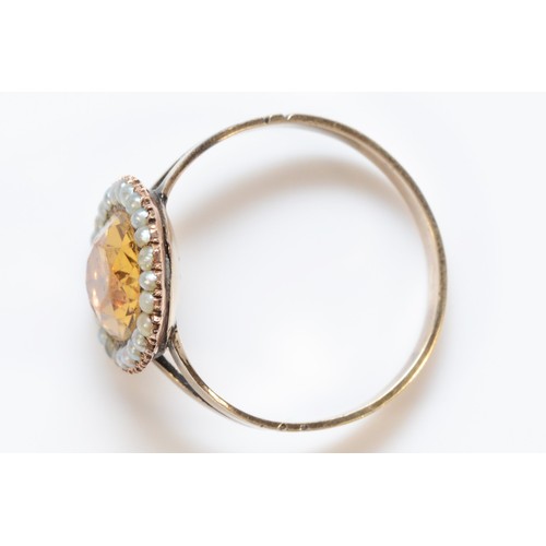 200 - A 9ct gold paste and seed pearl oval cluster ring, central paste measures 12mm x 9mm, O 1/2, 3.3g