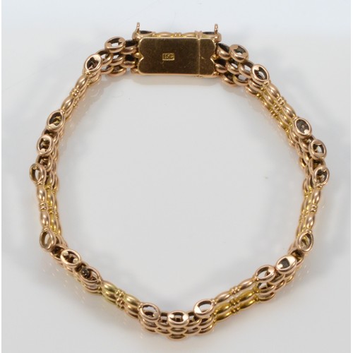 207 - An Edwardian 15ct rose gold gate bracelet, 15C stamp, 18cm, 17.3gm