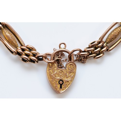 212 - An Edwardian 9ct rose gold Night and Day gate bracelet, with engraved heart padlock, 19cm, 12.3gm