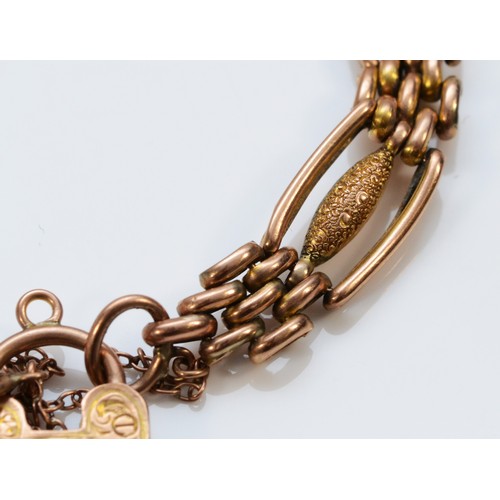 212 - An Edwardian 9ct rose gold Night and Day gate bracelet, with engraved heart padlock, 19cm, 12.3gm