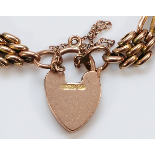 212 - An Edwardian 9ct rose gold Night and Day gate bracelet, with engraved heart padlock, 19cm, 12.3gm