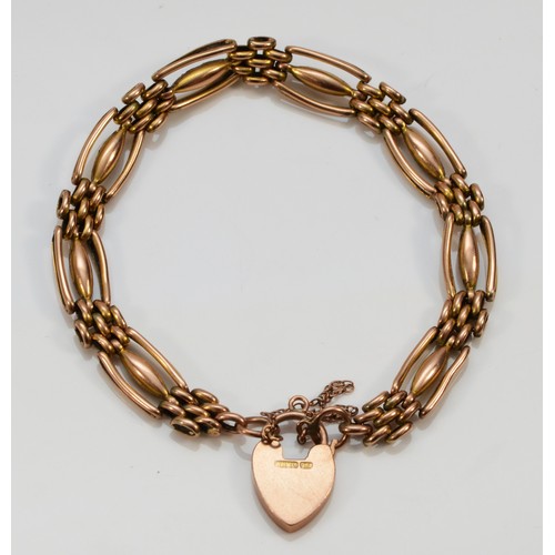 212 - An Edwardian 9ct rose gold Night and Day gate bracelet, with engraved heart padlock, 19cm, 12.3gm