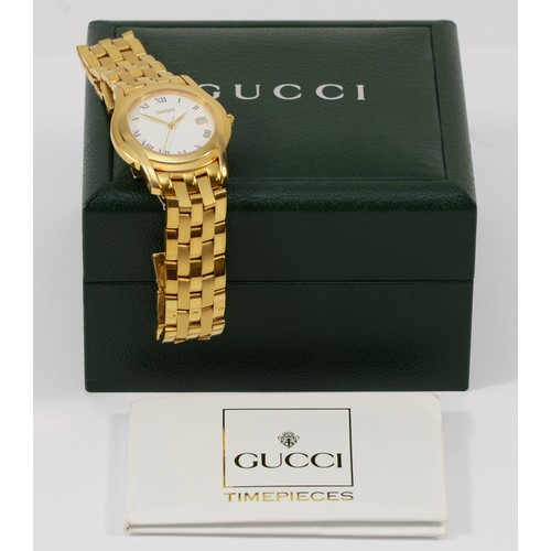 233 - Gucci, a gold plated date quartz gentleman's wristwatch, ref 5400M, 34mm, booklet and case.
Working ... 