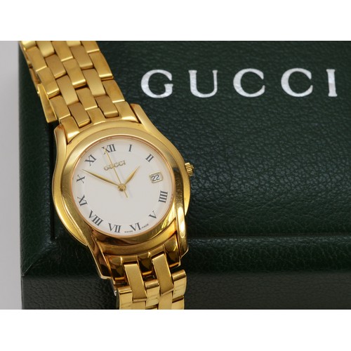 233 - Gucci, a gold plated date quartz gentleman's wristwatch, ref 5400M, 34mm, booklet and case.
Working ... 