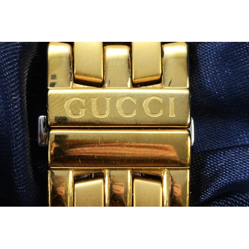 233 - Gucci, a gold plated date quartz gentleman's wristwatch, ref 5400M, 34mm, booklet and case.
Working ... 