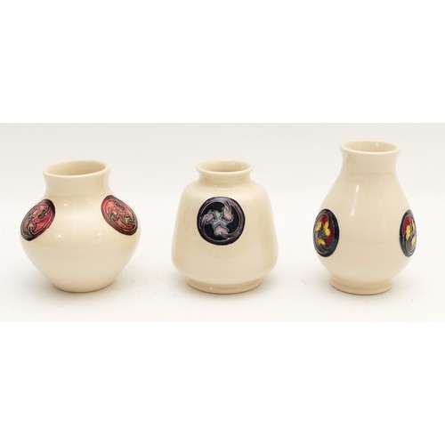 316 - Three Moorcroft Flaminian miniature cream vases, with marks to the bases, the tallest is H-10cm. (3 ... 