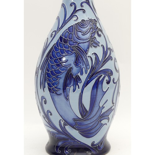 323 - A Moorcroft slender neck baluster vase, in the pattern, 'Trial', featuring fish / carp, H-36cm.