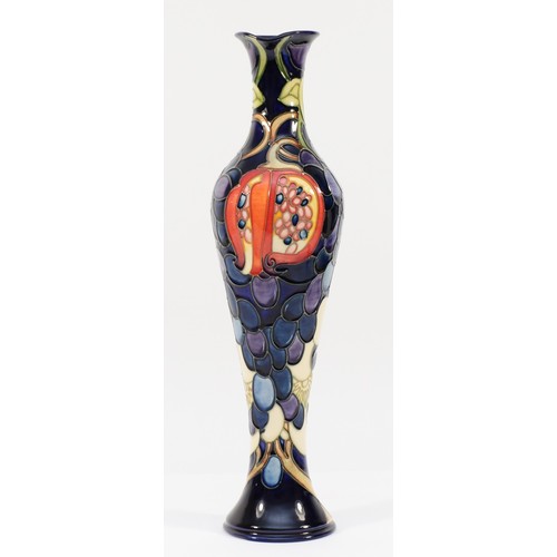 332 - A Moorcroft ewer, depicting florals, grapes and a pomegranate, designed by Anji Davenport, H-32cm.