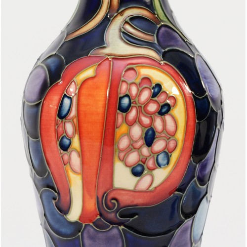 332 - A Moorcroft ewer, depicting florals, grapes and a pomegranate, designed by Anji Davenport, H-32cm.