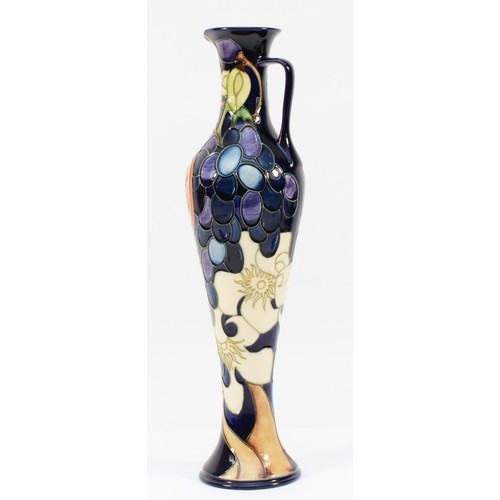 332 - A Moorcroft ewer, depicting florals, grapes and a pomegranate, designed by Anji Davenport, H-32cm.