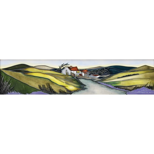 335 - A Moorcroft plaque, depicting house nestled amongst green hills, with a river in the foreground, des... 